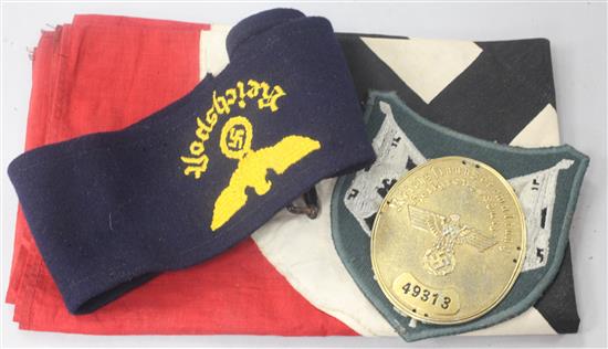 A Swastika flag and two badges